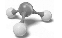 Modèle moléculaire compact de l'ammoniac : une sphère grise centrale reliée à trois sphères blanches disposées en pyramide autour d'elle.